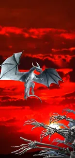 Silver dragon flying in fiery red sky with skeletons.