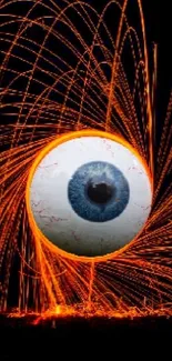 Fiery eye with orange streaks on dark background wallpaper.