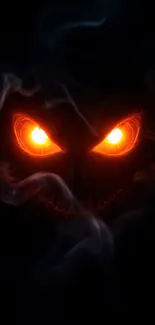 Black background with fiery glowing eyes emerging from smoke.