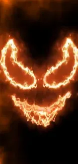 Fiery face design glowing with orange flames against a dark background.