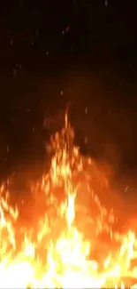 Mobile wallpaper featuring dynamic orange flames on a dark background.