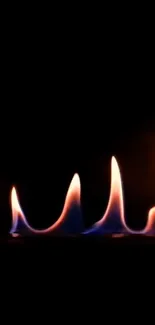 Artistic orange and blue flames on a dark background wallpaper.