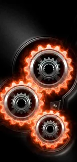 Wallpaper with fiery gears and orange flames on black.