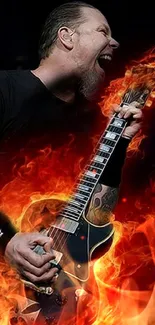 Guitarist playing with fiery effect on a dark background.