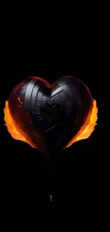 Metallic heart with fiery accents on a black background.