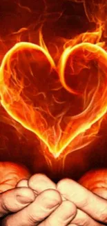 Fiery heart mobile wallpaper with hands cradling a vibrant orange flame heart.