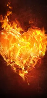 Fiery orange heart made of flames on a dark background, perfect for mobile phones.