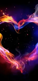 Fiery heart with orange and blue flames on a dark background wallpaper.