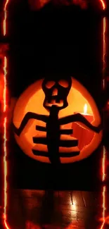 Halloween pumpkin with skeleton carving surrounded by fiery glow.