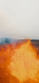 Vibrant orange lava flowing from a volcano, creating a fiery landscape.