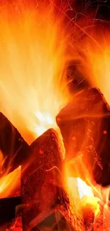 Vivid wallpaper of burning logs with glowing flames.