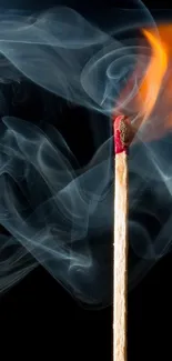 A lit matchstick with smoke on a dark background, creating fiery art.