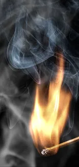 Burning matchstick with rising smoke on a dark background.