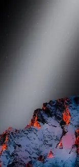 Wallpaper of glowing fiery peaks against a dark night sky.