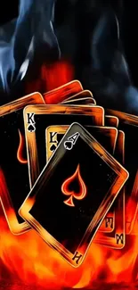 Playing cards engulfed in flames with smoky background.