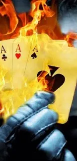 Fiery playing cards held in glove with flames.