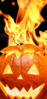 Halloween pumpkin engulfed in flames with a spooky glow.