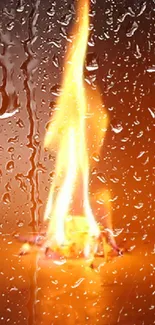 Orange flame behind rain-speckled glass mobile wallpaper.