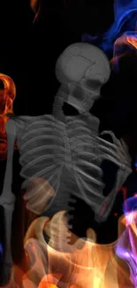 Skeleton surrounded by vivid blue and orange flames on a black background.