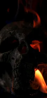 A dark skull surrounded by vivid orange flames.