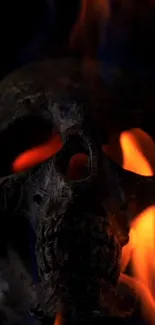 A dark, fiery skull with vivid orange flames.