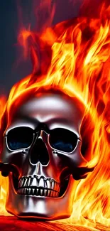 Skull engulfed in vibrant flames on a mobile wallpaper.