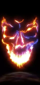 Fiery neon skull with bold flames on black background.