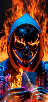 Hooded figure with flaming skull mask holding a card, set on fire.