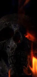 Dark skull wallpaper with fiery flames and gothic theme.