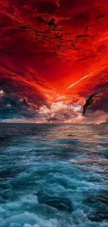 Dynamic mobile wallpaper with fiery sky over ocean waves.