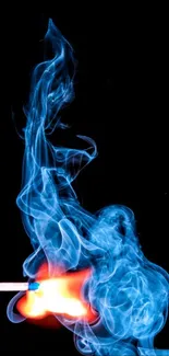 Blue fiery smoke rises from a matchstick.