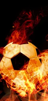 Fiery soccer ball engulfed in flames on a dark background.