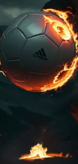 Fiery soccer ball wallpaper with flames on a dark background.