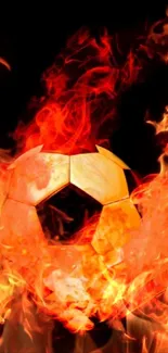 Soccer ball engulfed in bright, fiery flames against a black background.