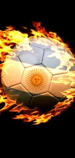 Soccer ball engulfed in flames against black background.