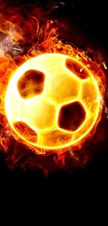 Fiery soccer ball engulfed in flames on a dark background.