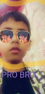 Young boy with fiery sunglasses and vibrant flames.