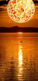 Fiery sunset reflecting over a tranquil lake.