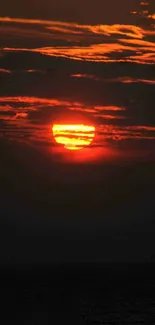 Fiery sunset with deep orange hues in the evening sky.