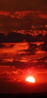 Fiery red sunset with clouds in the sky.