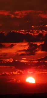 Stunning fiery sunset with red sky and clouds.