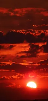 Fiery red and orange sunset with clouds.