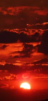 Fiery sunset sky with dark clouds and a glowing horizon.