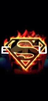 Superman emblem with Jesus text, fiery design on black background.