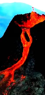 Fiery lava flowing from an erupting volcano against a stark landscape.