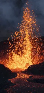 Fiery volcanic eruption with lava flow under a smoky sky.