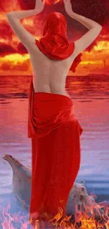 Mystical woman in red gown by fiery sunset.