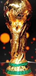 FIFA World Cup Trophy on black background.