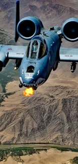 Fighter jet flying over a vast desert landscape.