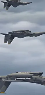 Three fighter jets soaring through a cloudy sky.